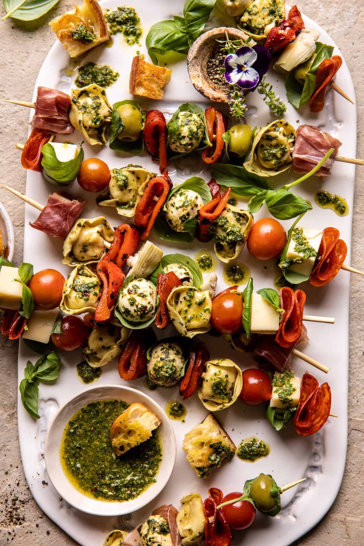 pesto tortellini skewers with cherry tomatoes and mozzarella