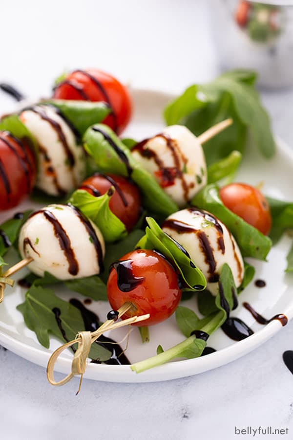 Caprese skewers with tomato mozzarella basil and balsamic glaze