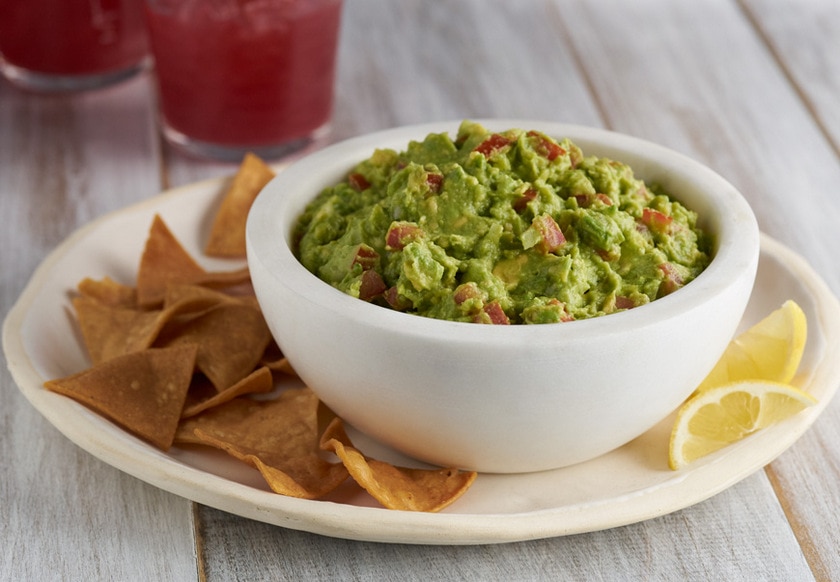 Fresh homemade guacamole with lime and cilantro