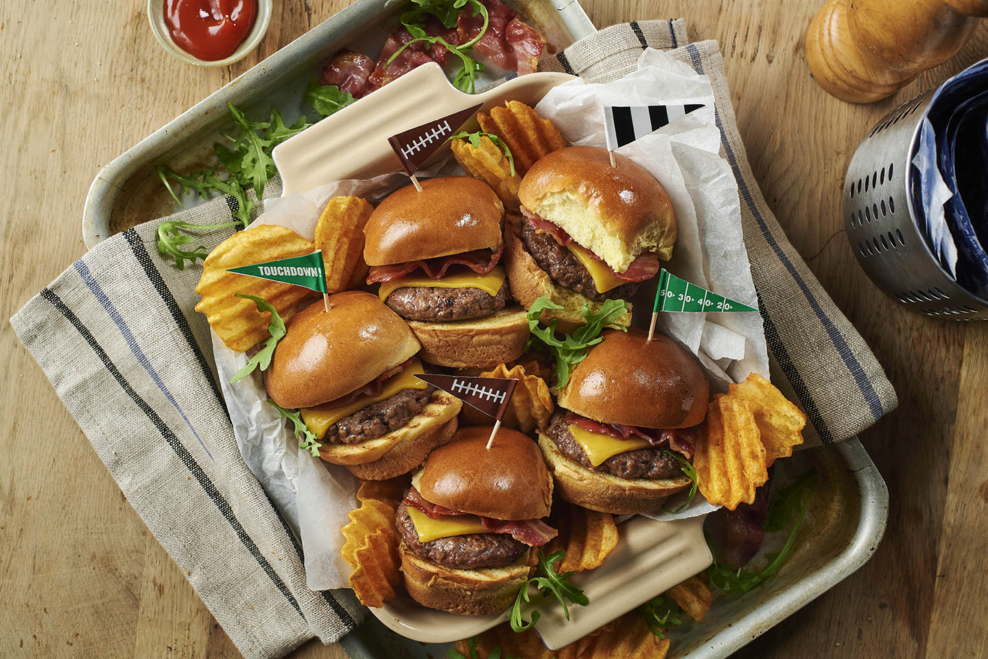mini cheeseburger sliders on a summer backyard food table