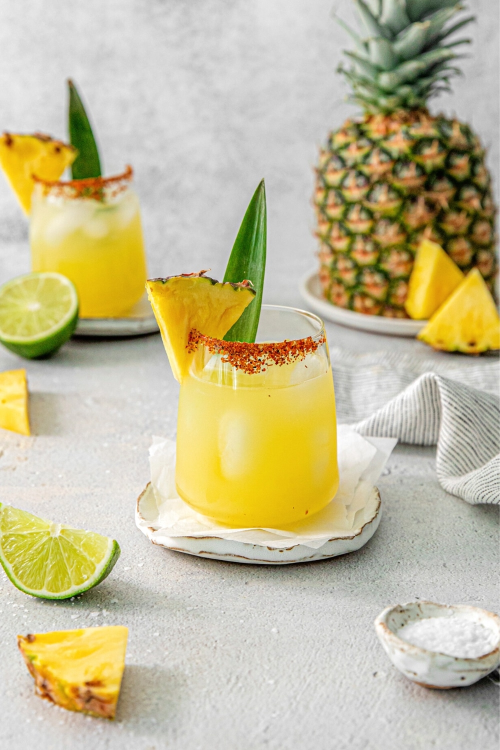 Pineapple margarita with Tajin rim and pineapple wedge