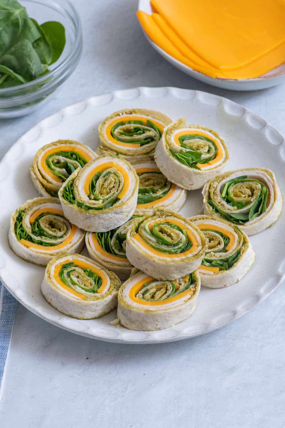 Picnic pinwheel sandwiches with ham cheese spinach and peppers