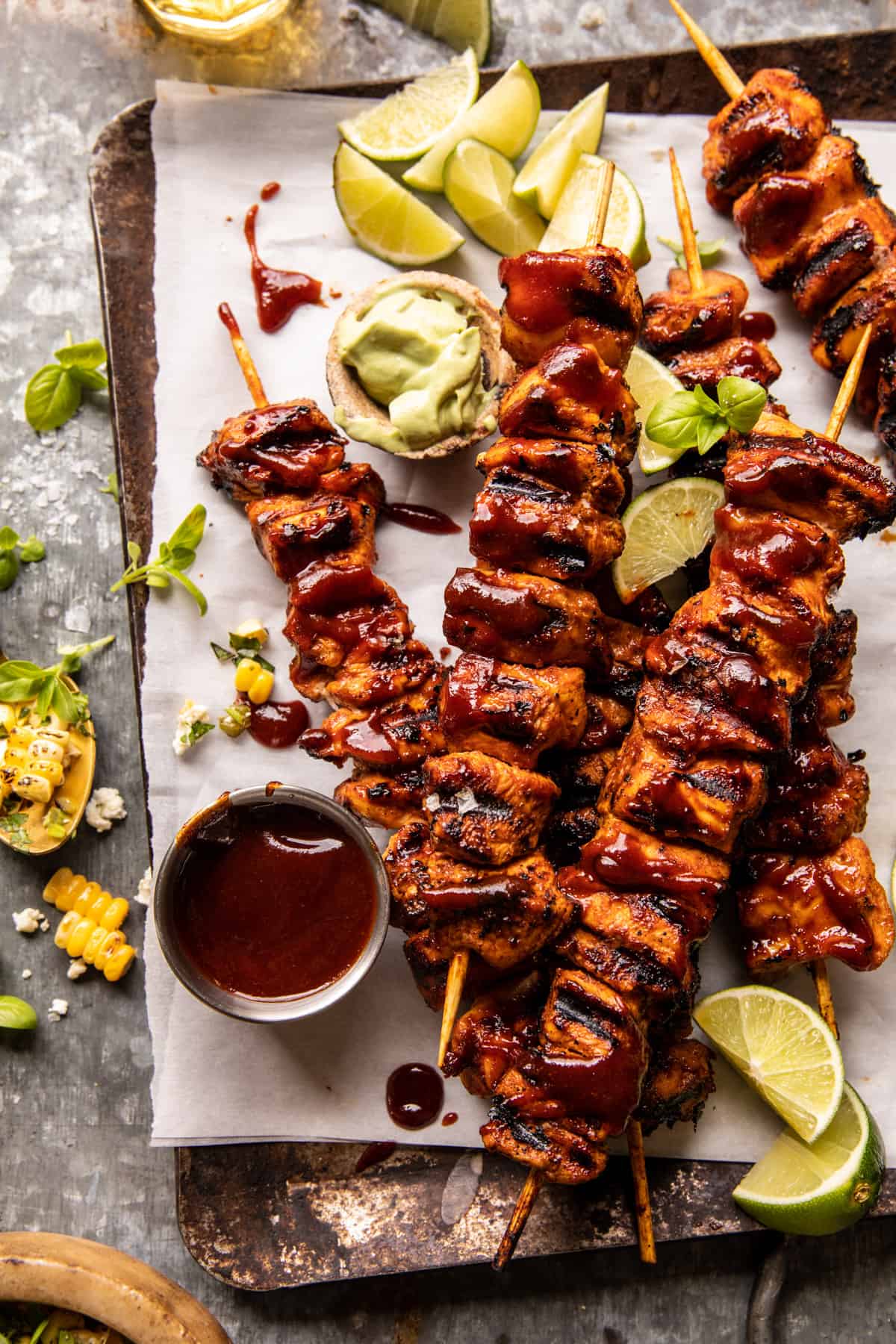 BBQ chicken skewers with peppers and onions on a grill platter