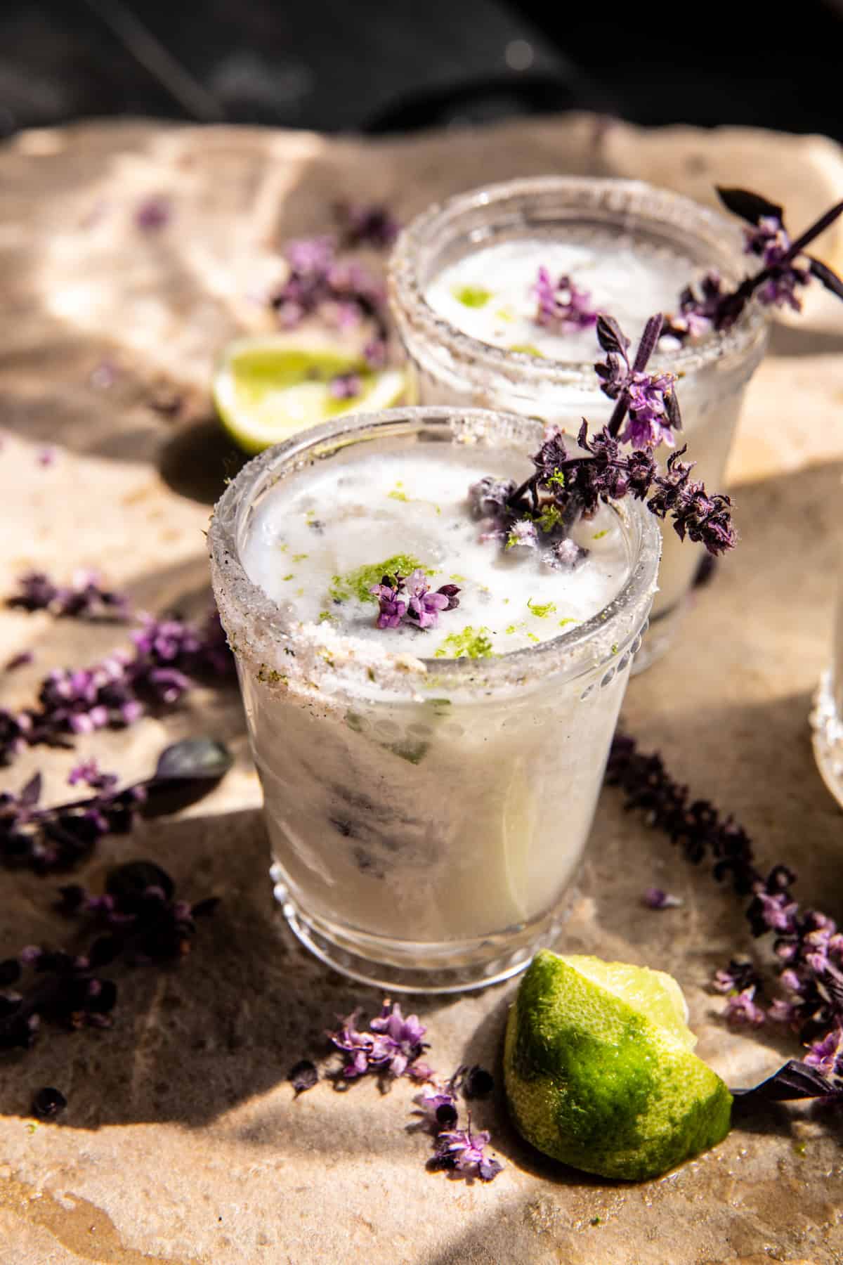 Coconut lime margarita with toasted coconut rim and lime wheel garnish