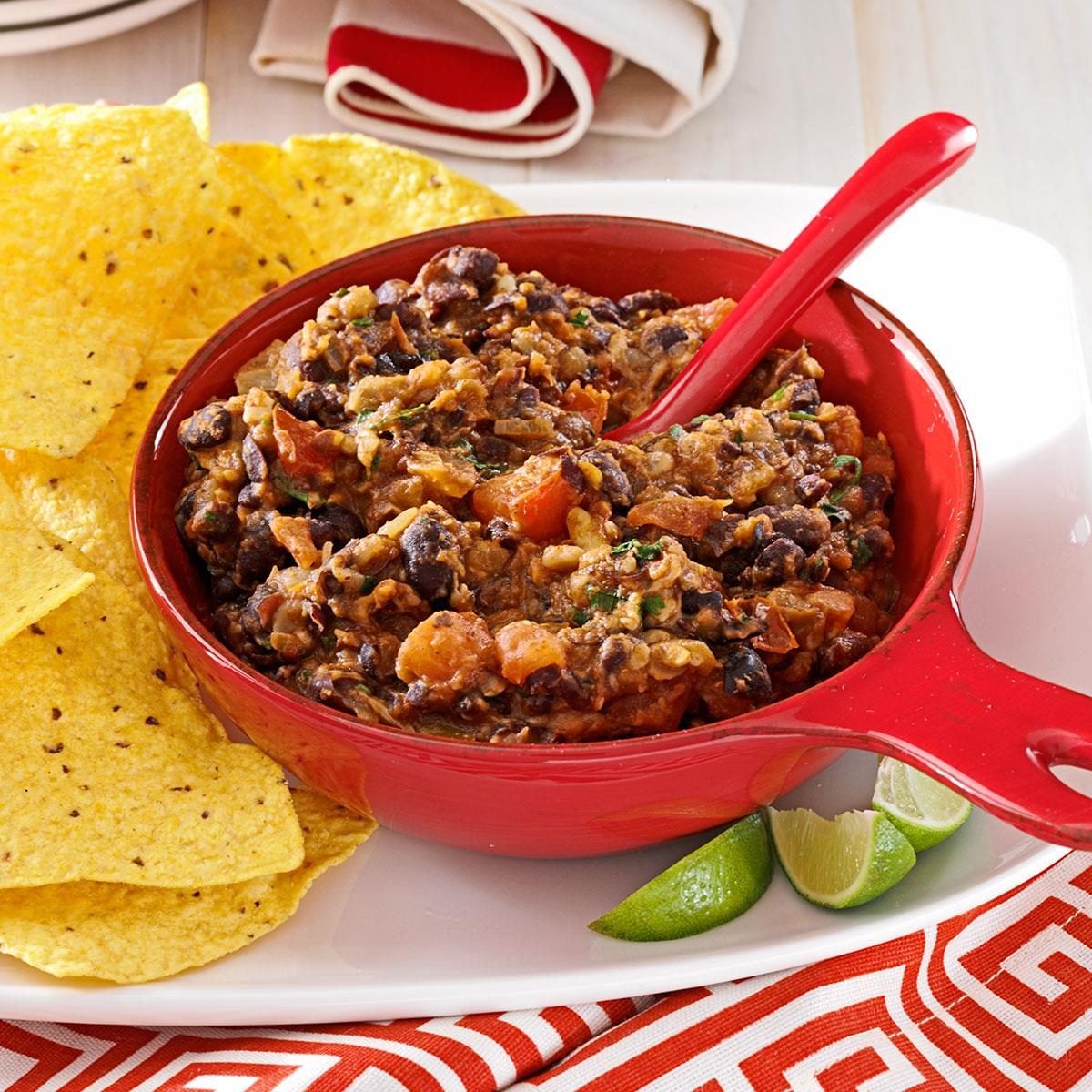 Warm black bean dip with melted cheese and tortilla chips
