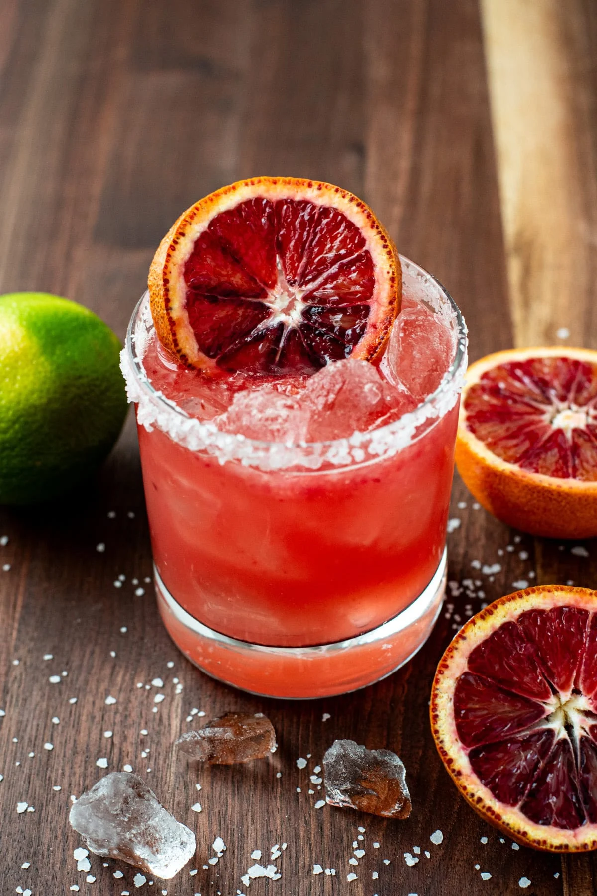 Blood orange margarita deep red in glass with orange slice