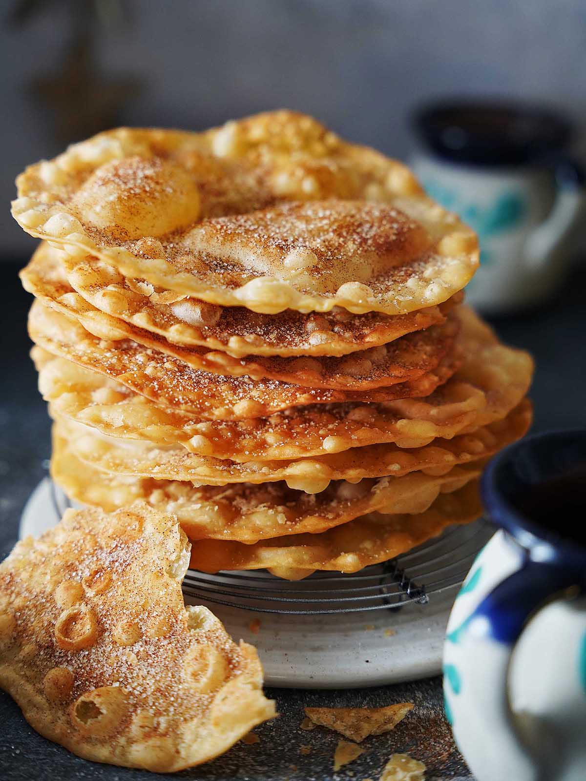 Buñuelos thin crispy fried discs coated in cinnamon sugar