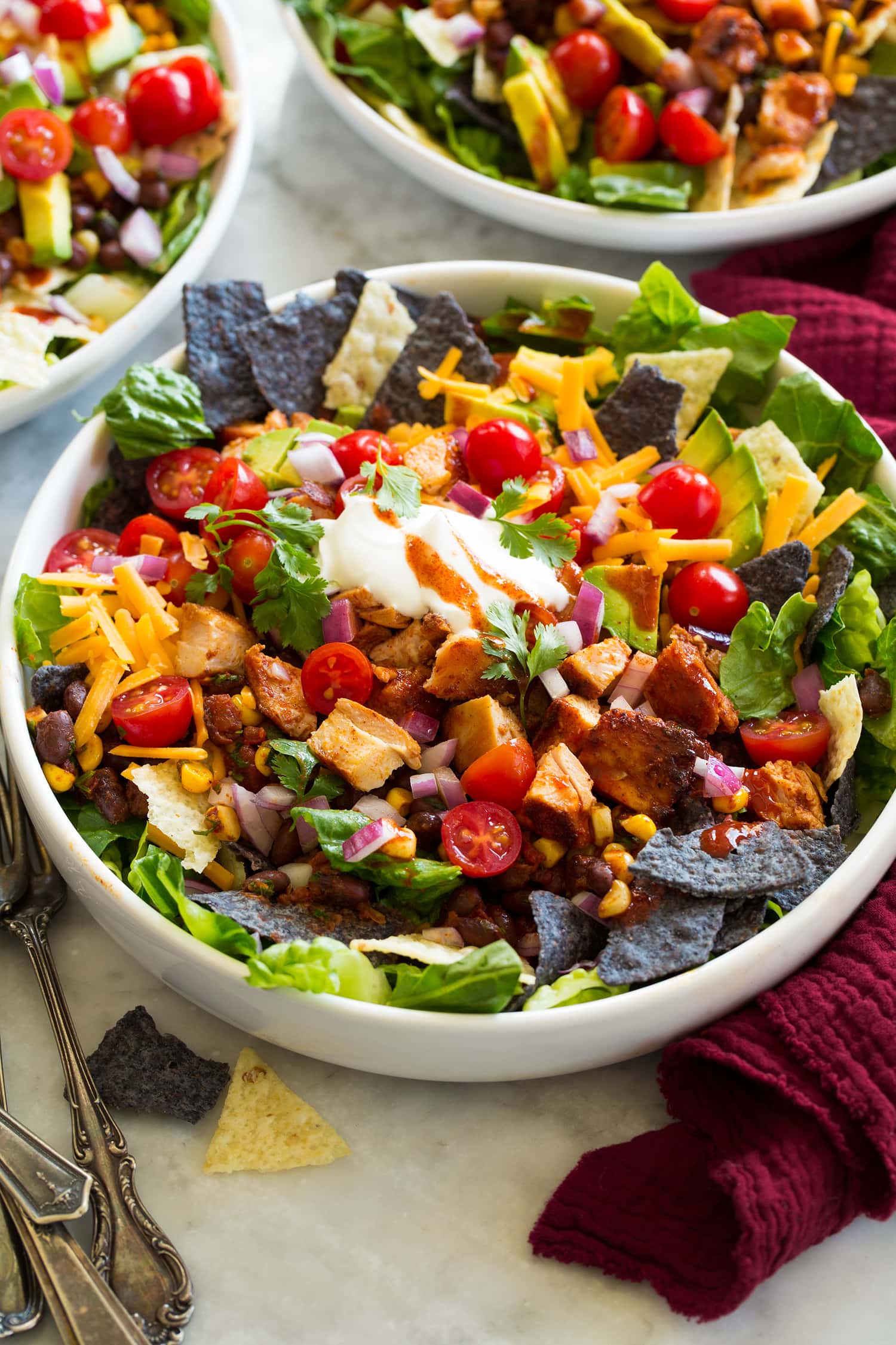 Mexican chicken taco salad with avocado beans and tortilla strips