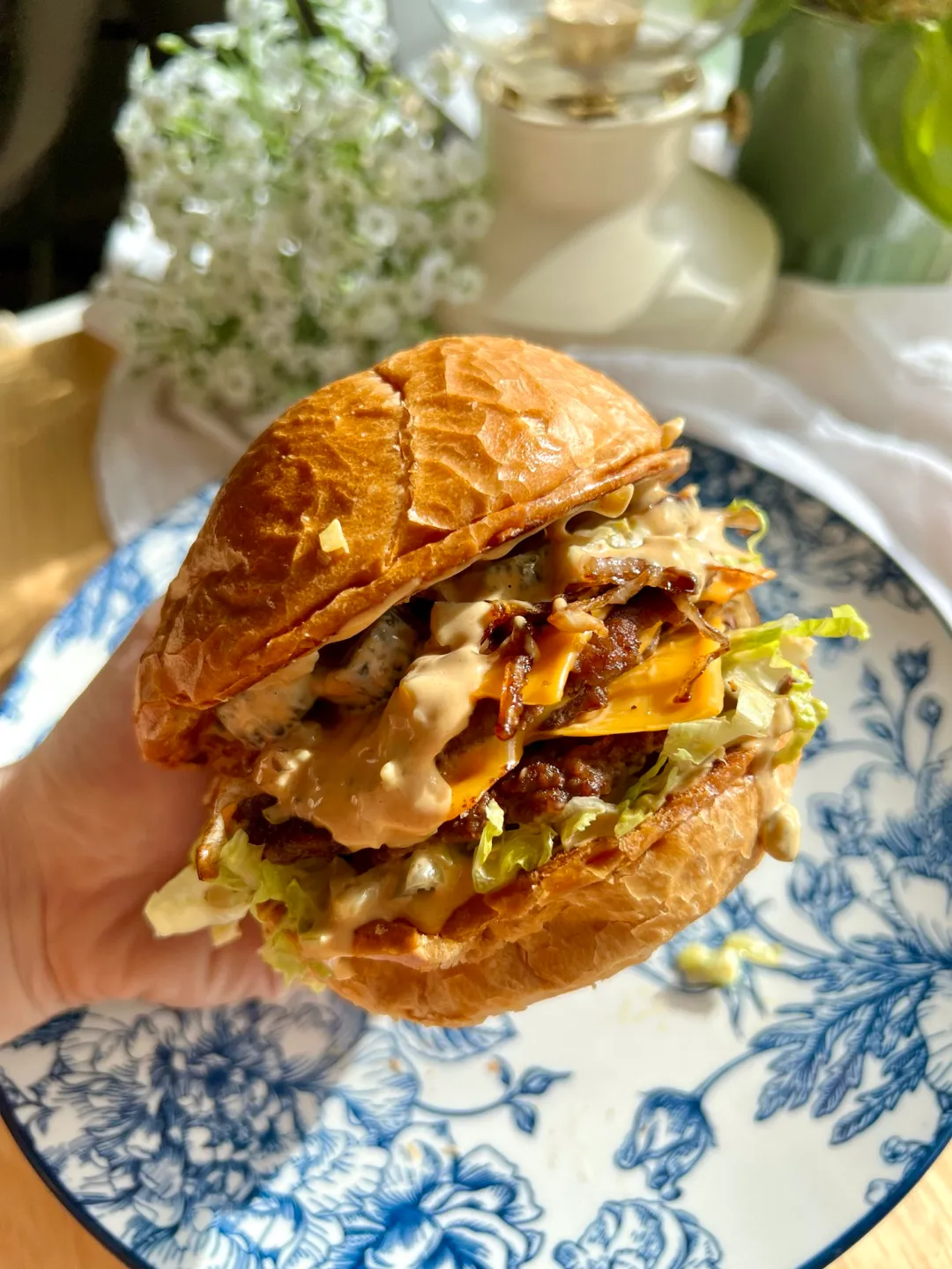 Smash burgers with melted cheese and pickles