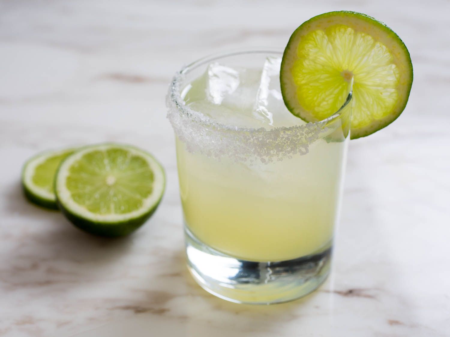 Classic lime margarita with salted rim and lime garnish