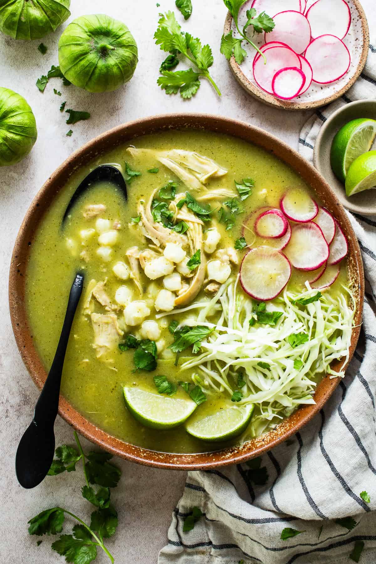Chicken pozole verde green tomatillo soup with hominy
