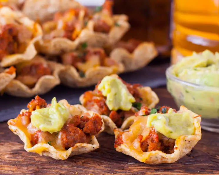 loaded nacho cups with cheese taco meat and toppings