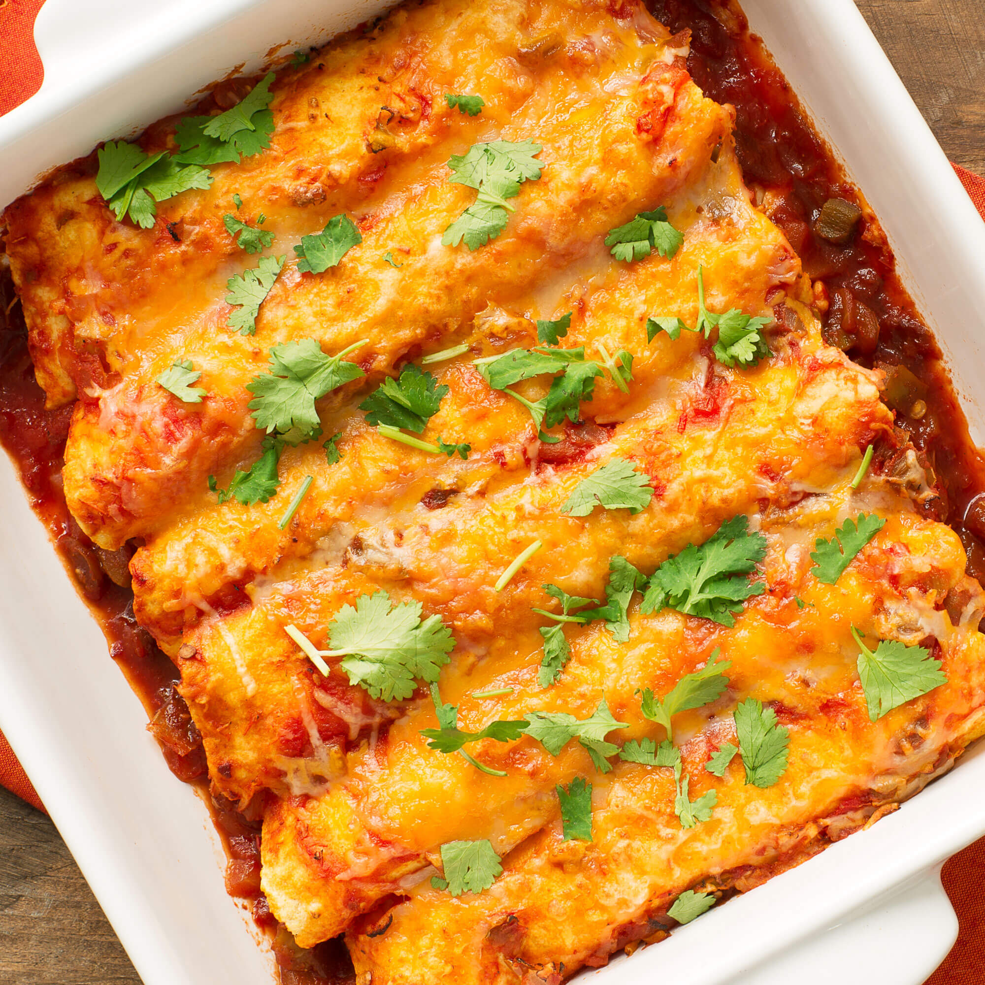 Chicken enchilada casserole layered with tortillas and melted cheese