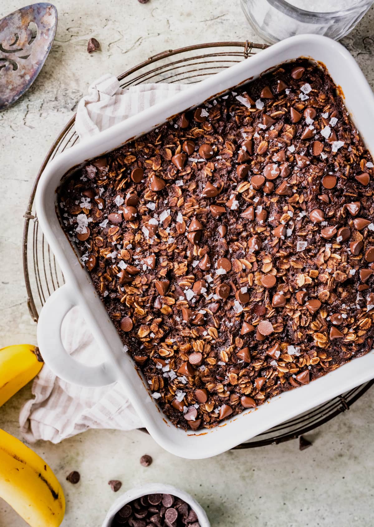 Chocolate banana baked oats in a ramekin with melted chocolate chips