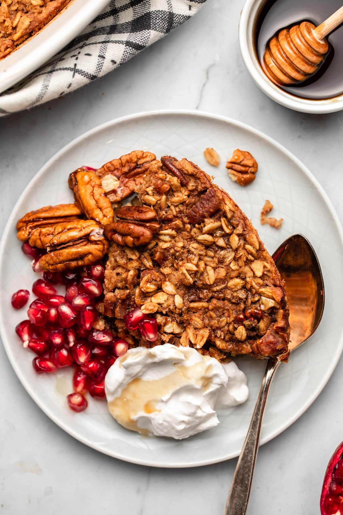 Maple walnut baked oats with syrup drizzle and crunchy walnuts on top