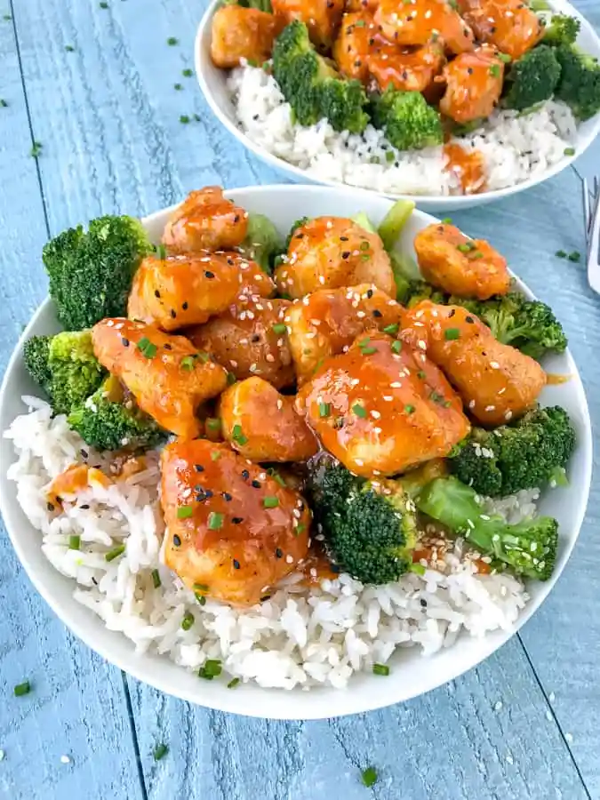 Low carb honey sriracha chicken bowl with cauliflower rice and vegetables