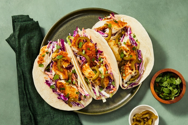 Lemon herb fish tacos with cucumber slaw and yogurt sauce