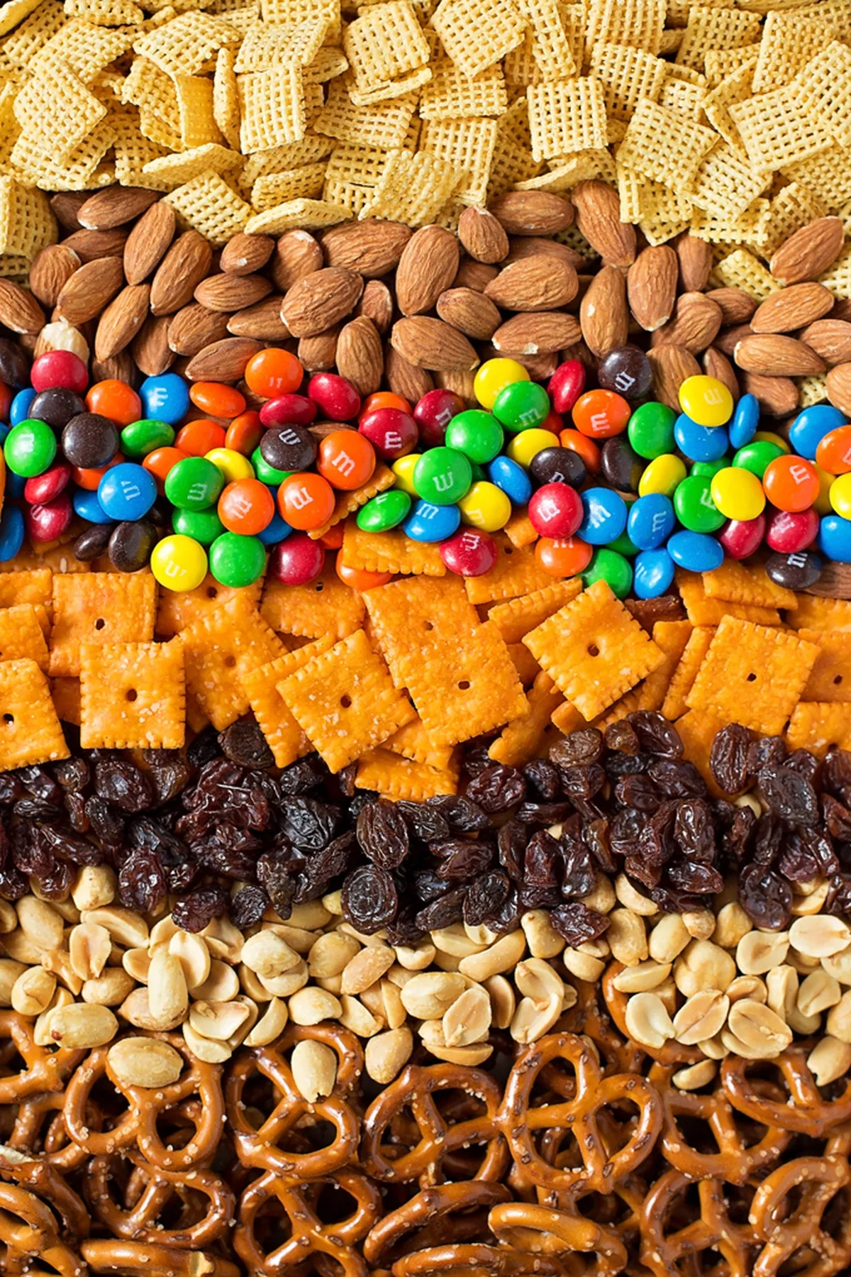 Back to school trail mix with cereal pretzels raisins sunflower seeds chocolate candies and yogurt raisins