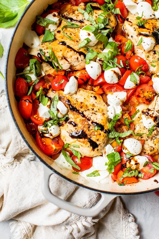 Caprese chicken skillet with tomatoes mozzarella basil and balsamic glaze