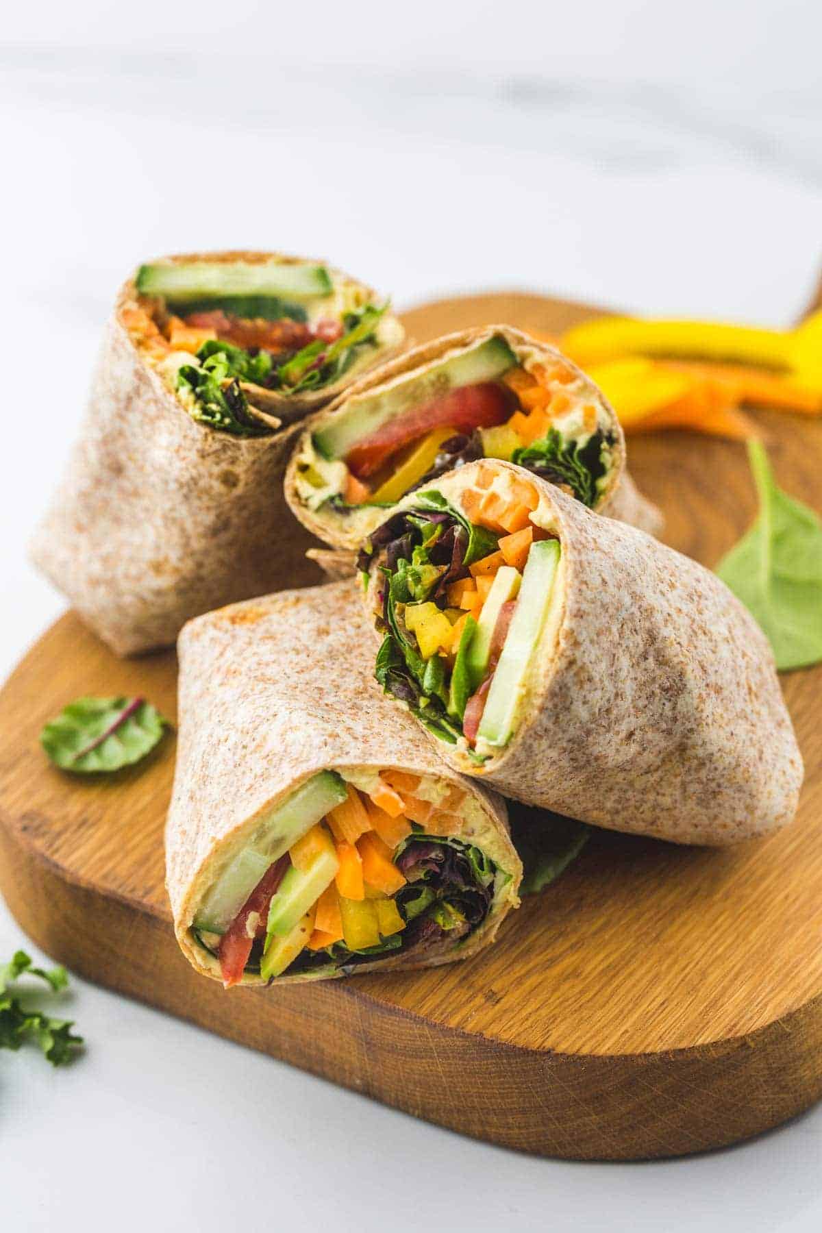 Veggie hummus wraps with cucumber and peppers for beach lunch