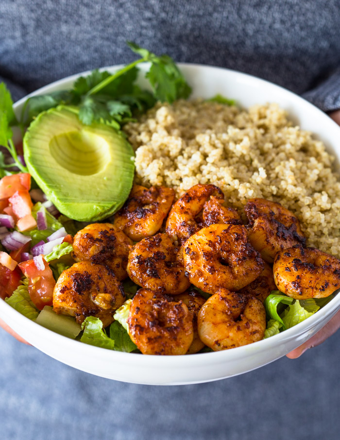 Shrimp avocado quinoa bowls with black beans corn tomatoes and lime