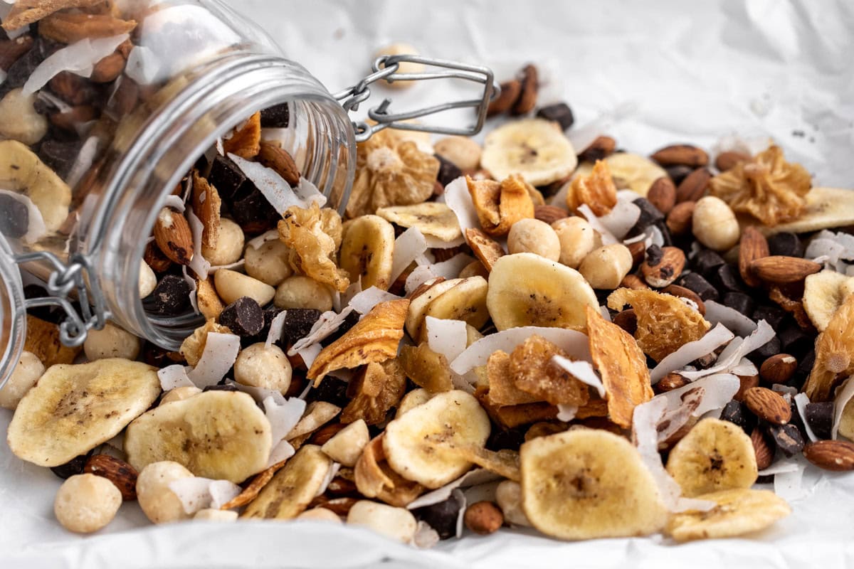 Banana nut trail mix with banana chips walnuts pecans cereal raisins chocolate and cinnamon