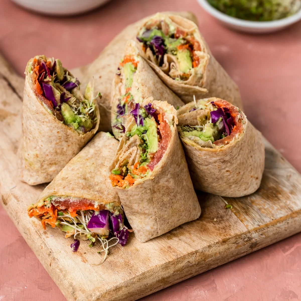 Veggie hummus wraps with cucumber carrots peppers feta and greens