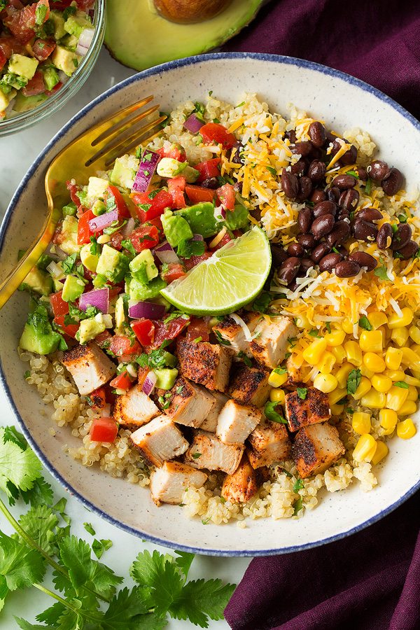 Grilled chicken avocado bowls with corn cucumber tomatoes and lime dressing