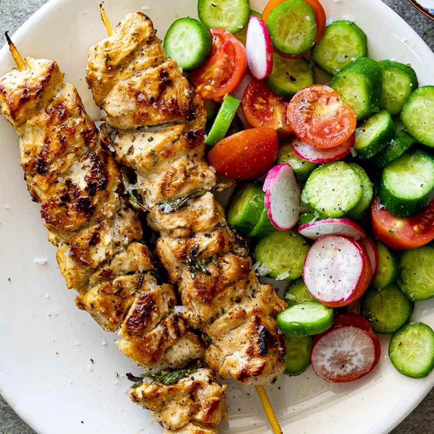 Lemon herb chicken skewers with zucchini peppers and red onion