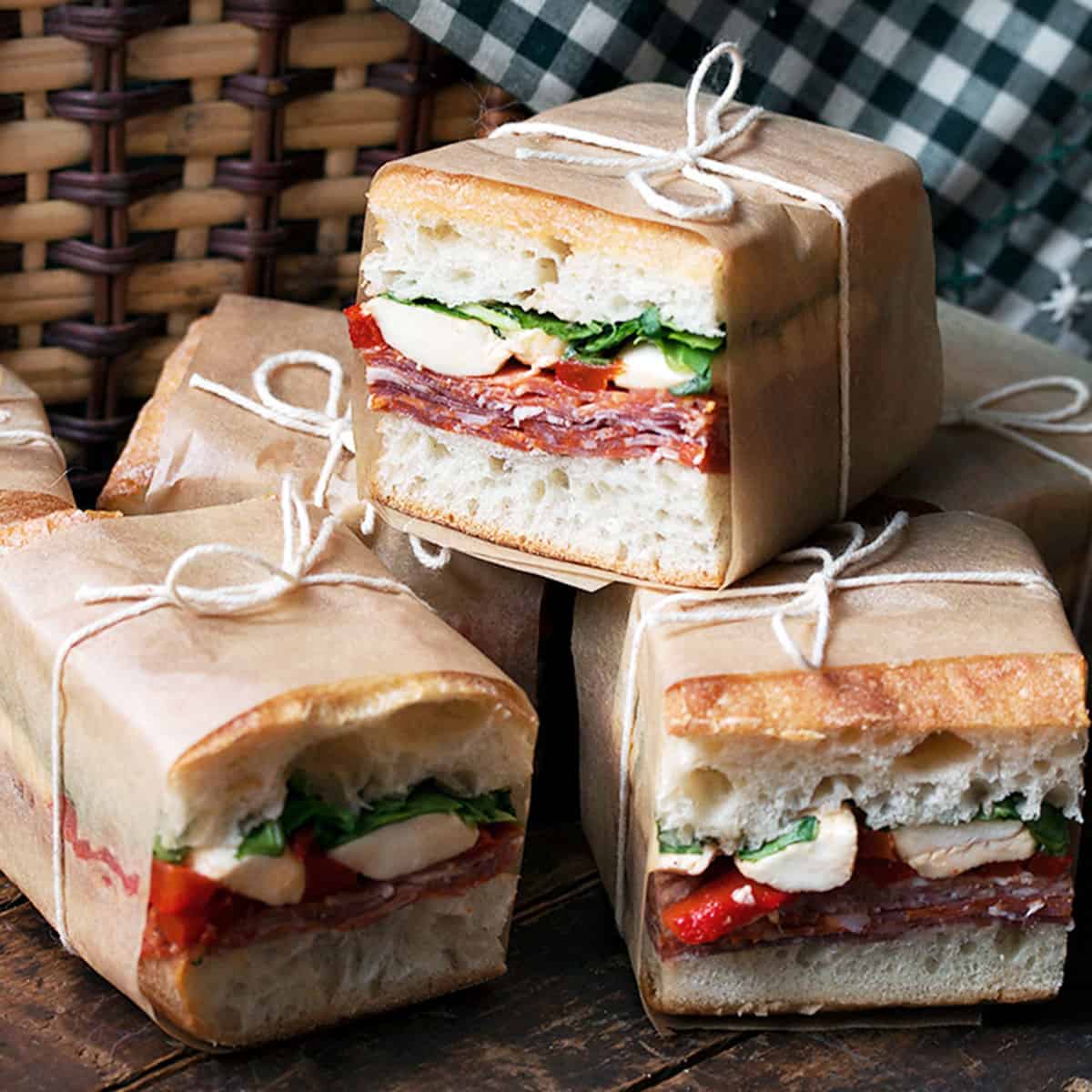 Italian pressed picnic sandwich sliced for a beach day