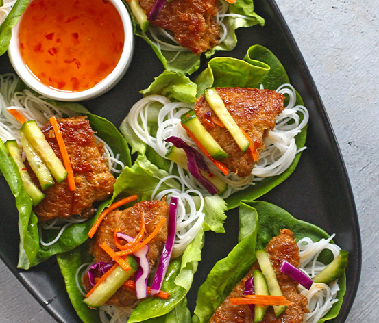 Turkey burger lettuce wraps with avocado tomato and sauce