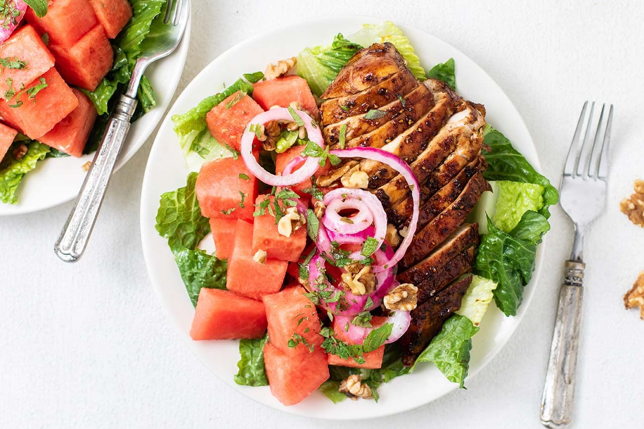 Watermelon feta chicken salad with cucumber mint and greens